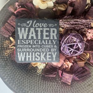 Slate coaster with funny alcohol quotes.